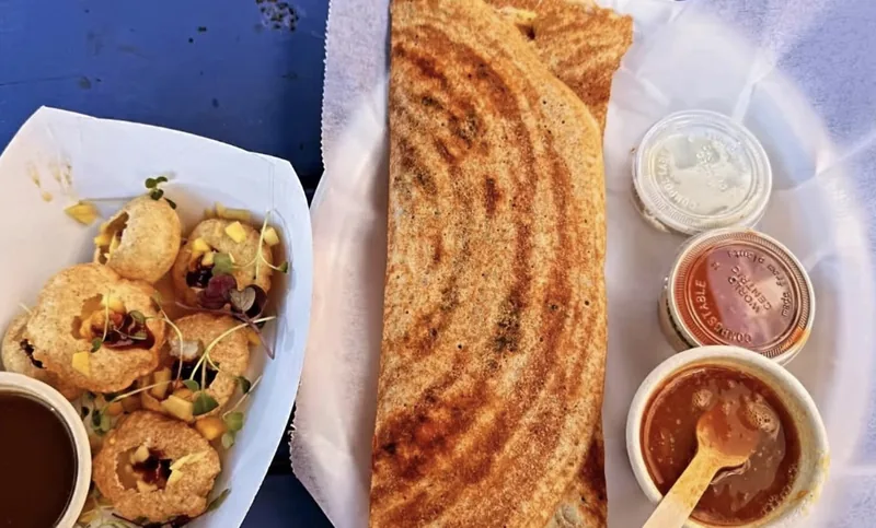 Pani puri and dosa together on the counter at Union Market