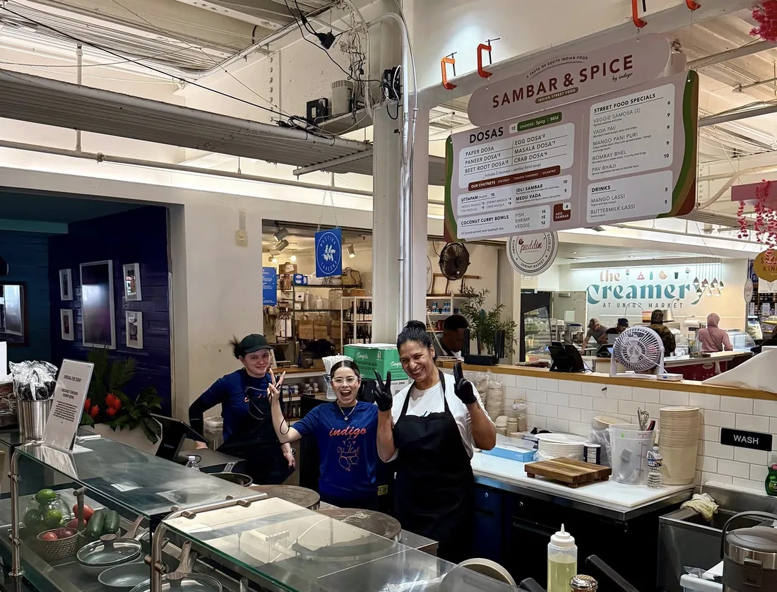 The Sambar and Spice stall at Union Market, with the menu board hanging above the counter